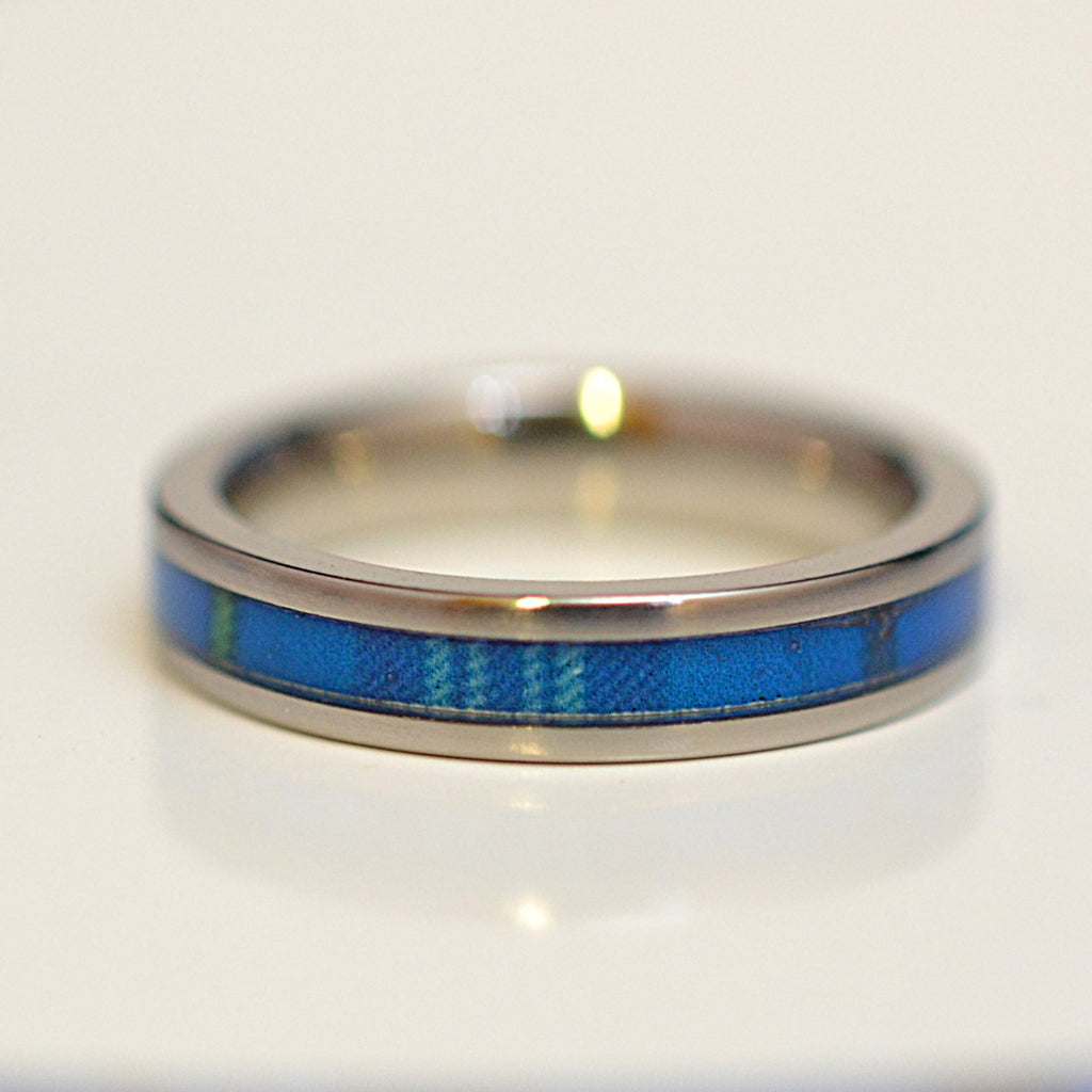 Front view of handcrafted stainless steel ring featuring The Citadel tartan inlay