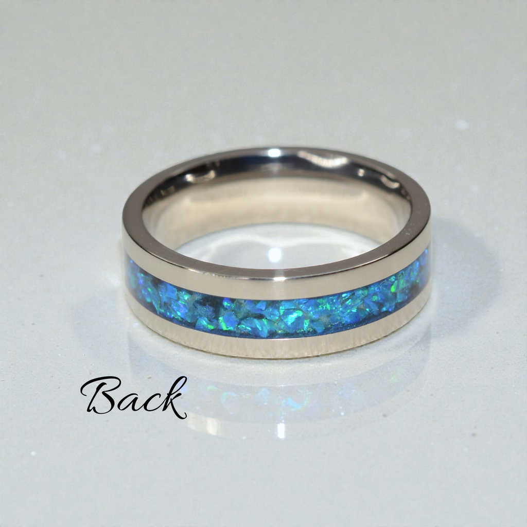 Back view of the Heart & Soul titanium ring showing the continuous crushed opal band inlay.