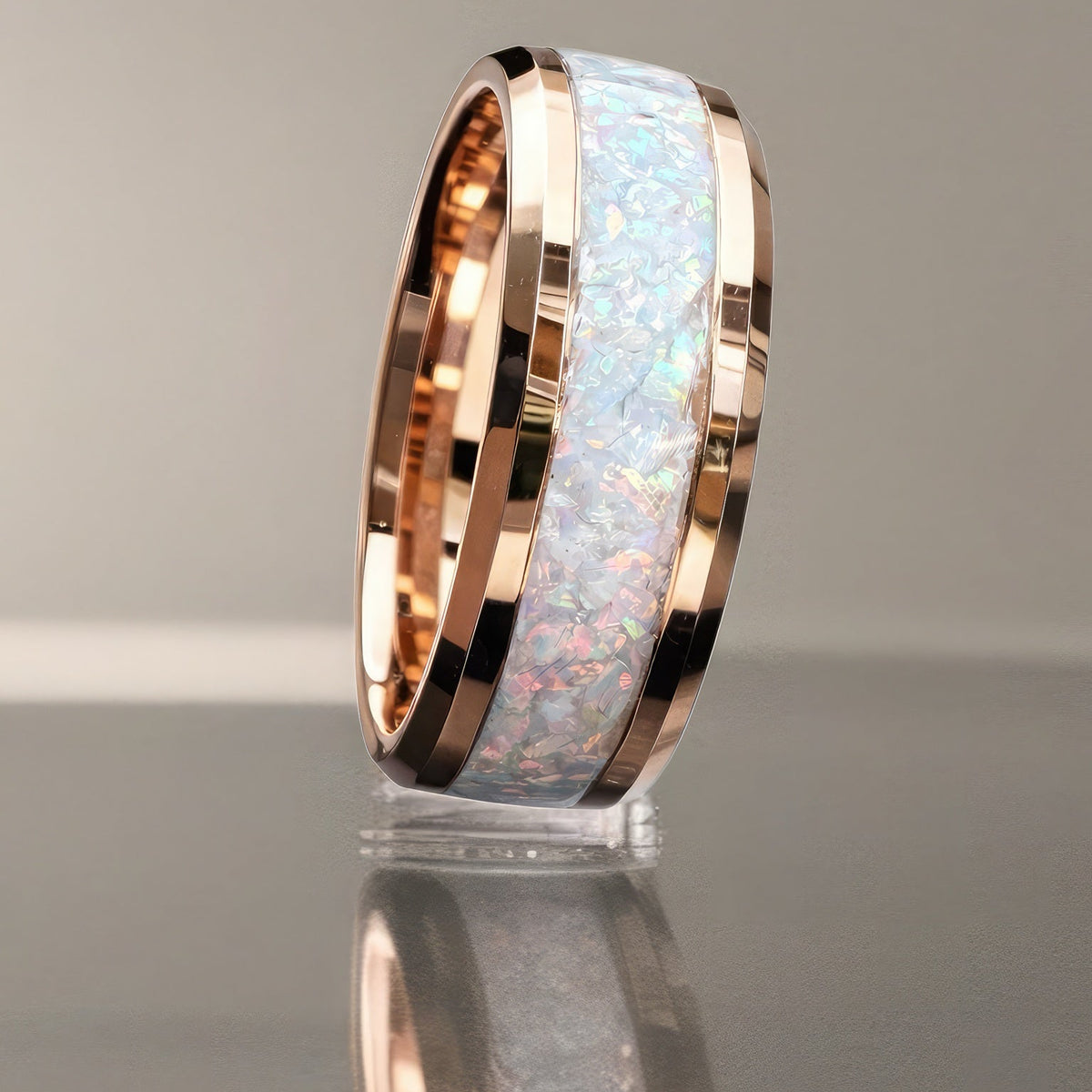 Standing view of the 8 mm Radiant Ice rose gold tungsten ring with luminous crushed white opal inlay.