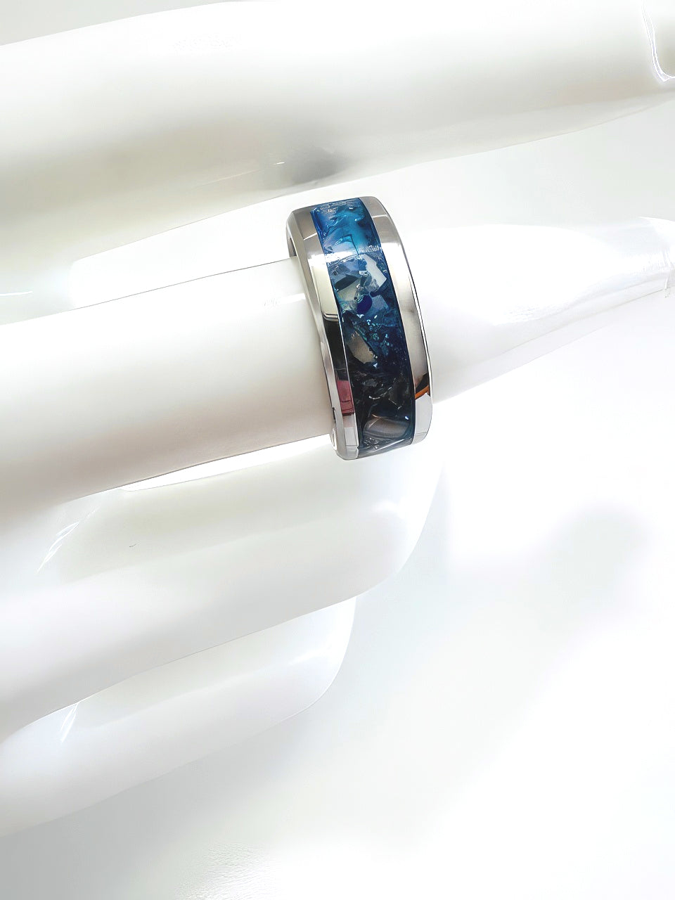 Gorgeous blue lapis lazuli set into a gleaming silver band ring with a deep clear top coat