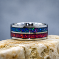 Handmade two-channel opal inlay ring featuring blue and red crushed opal in a polished stainless steel comfort-fit band.