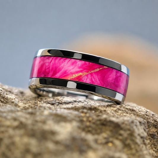 Sunrise Studio in Steel ring handcrafted from an original alcohol ink painting, featuring vibrant pink, rose, and golden sunrise tones beneath a crystal-clear finish.