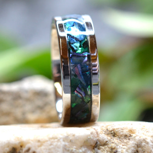Blue Lagoon handcrafted abalone shell ring displaying vibrant ocean-inspired blue and green colors in a polished stainless steel band.
