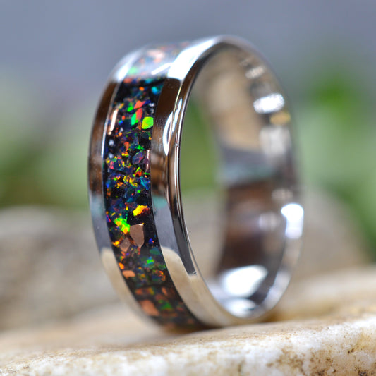 Side view of the Midnight Forge stainless steel black opal ring with genuine copper fragments and crushed black fire opal.
