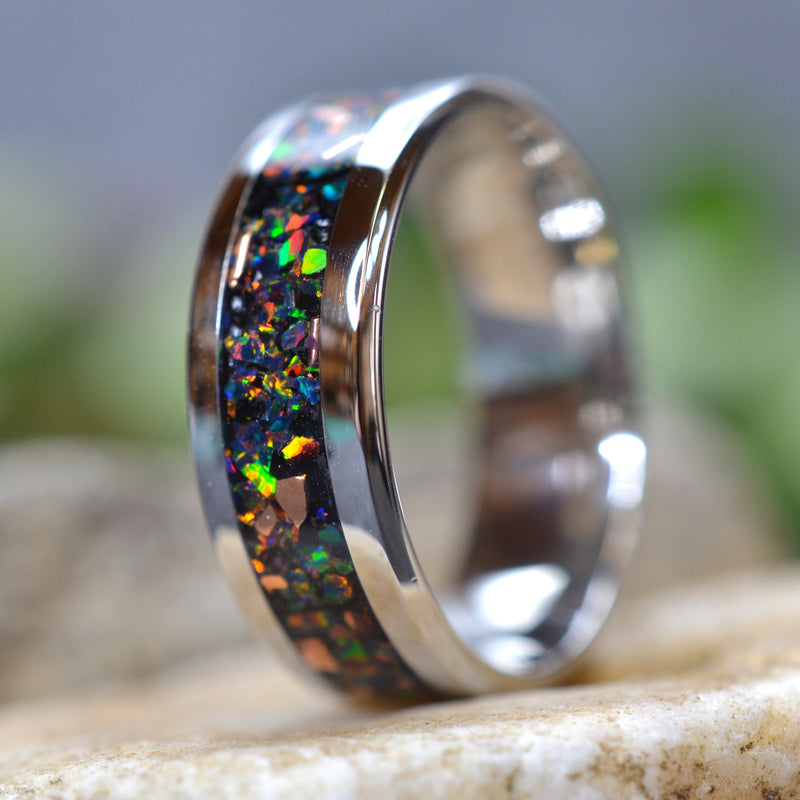 Side view of the Midnight Forge stainless steel black opal ring with genuine copper fragments and crushed black fire opal.