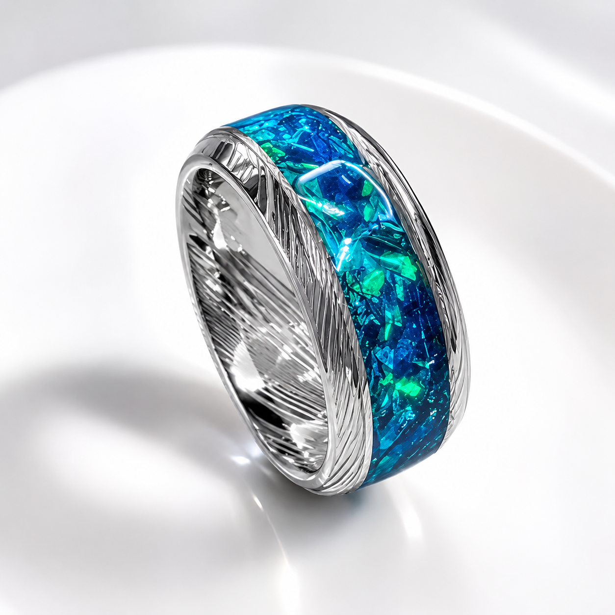 Handmade Damascus steel opal ring featuring a vibrant blue crushed opal inlay in a genuine Damascus steel comfort-fit band.