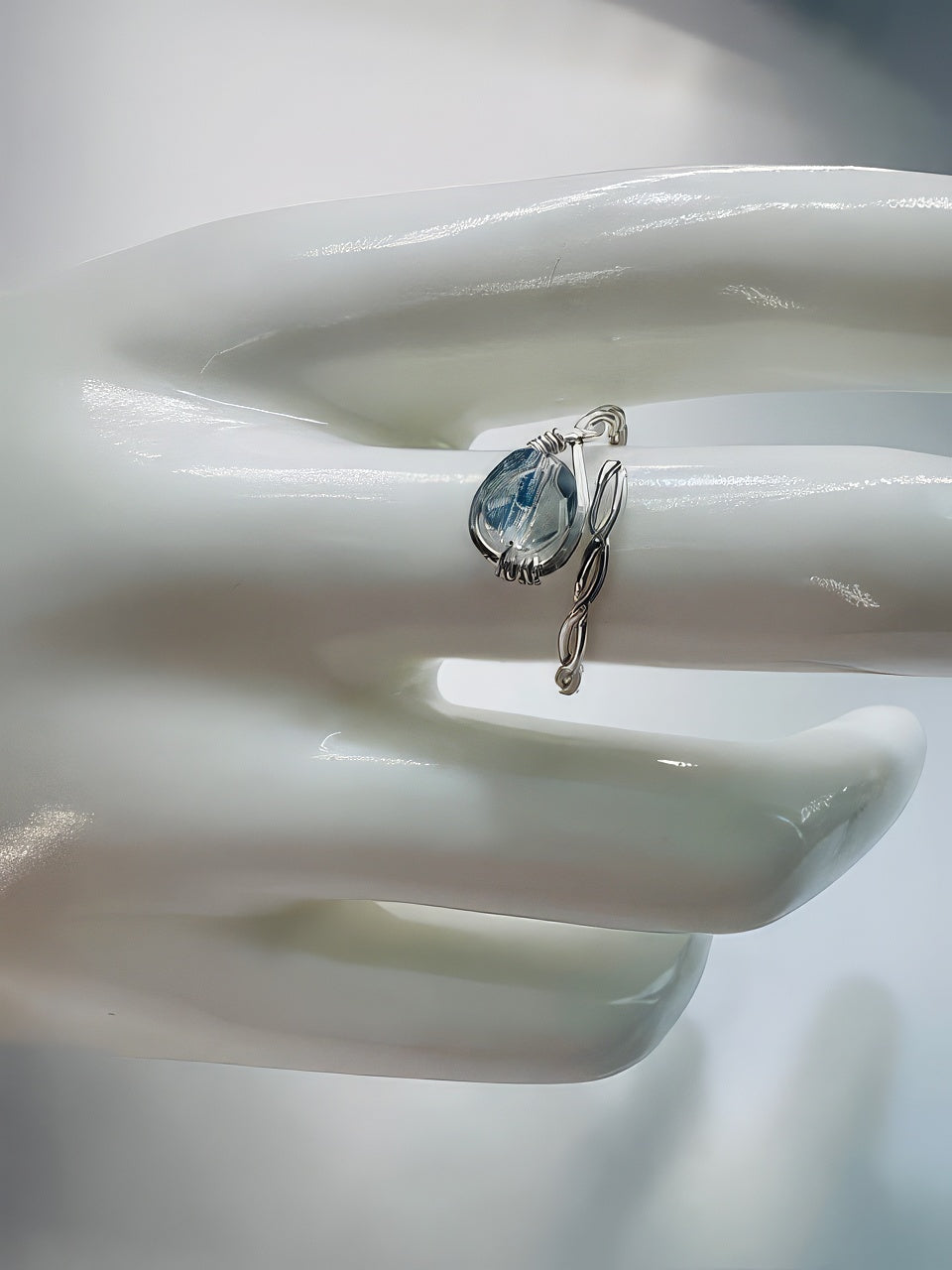 Baby blue faceted Czech bead hand wired into a handmade twisted silver ring