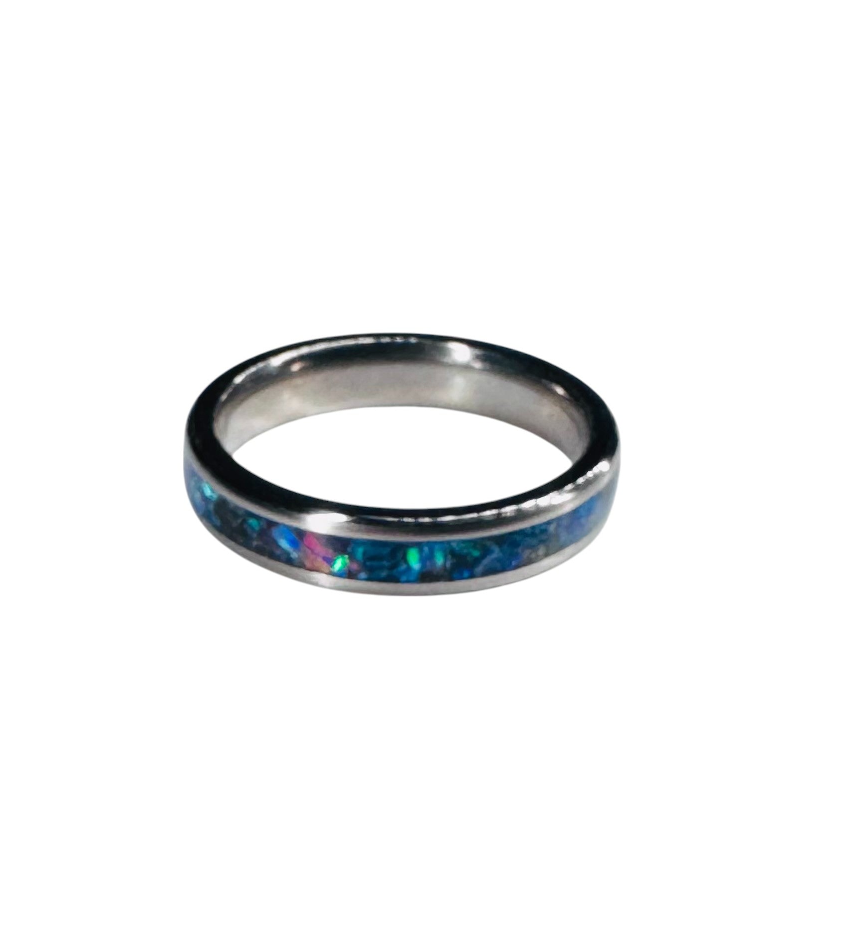 Iridescent blue and green crusted opals in an eye-catching silver band ring