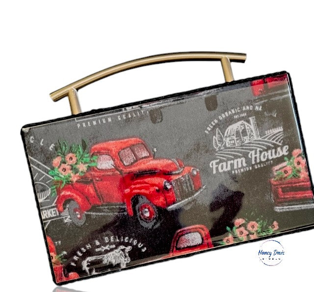 Box purse with with a red truck design and 'Farm House' text on a white background