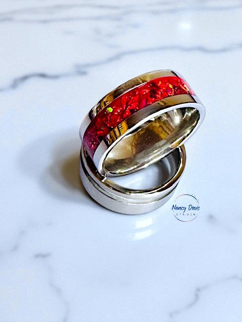 Fire-red  lab-grown opals and metallic flakes in a silver band ring