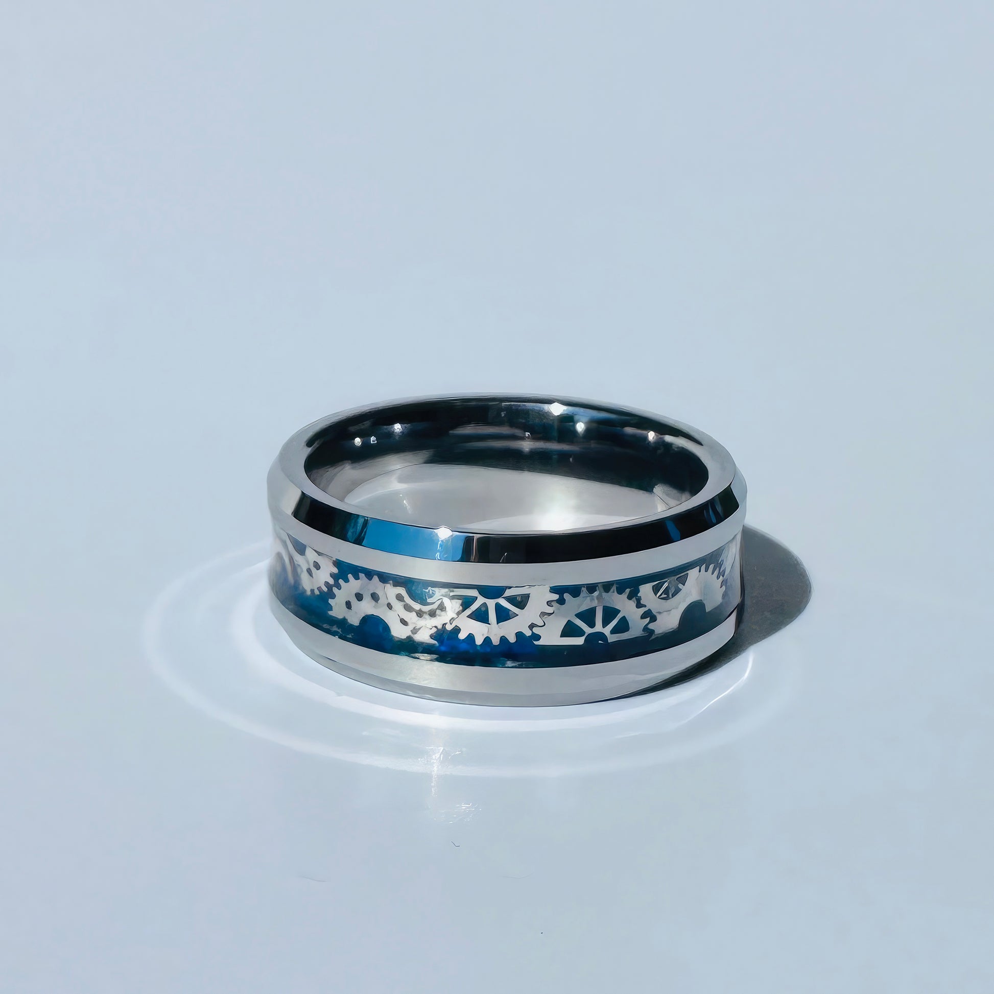 Polished titanium ring with indigo gear inlay and comfort fit band