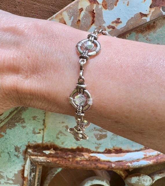 Mirrored Czech faceted beads hand wired into a round silver link bracelet