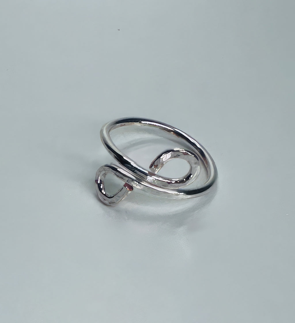 Handmade silver wire ring with two delicate swirls, hammered for super shiny texture