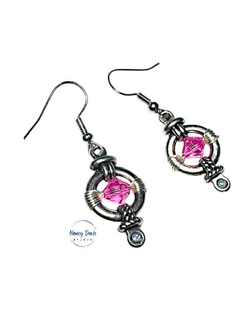 Pink faceted Swarovski crystals hand woven into round silver earrings