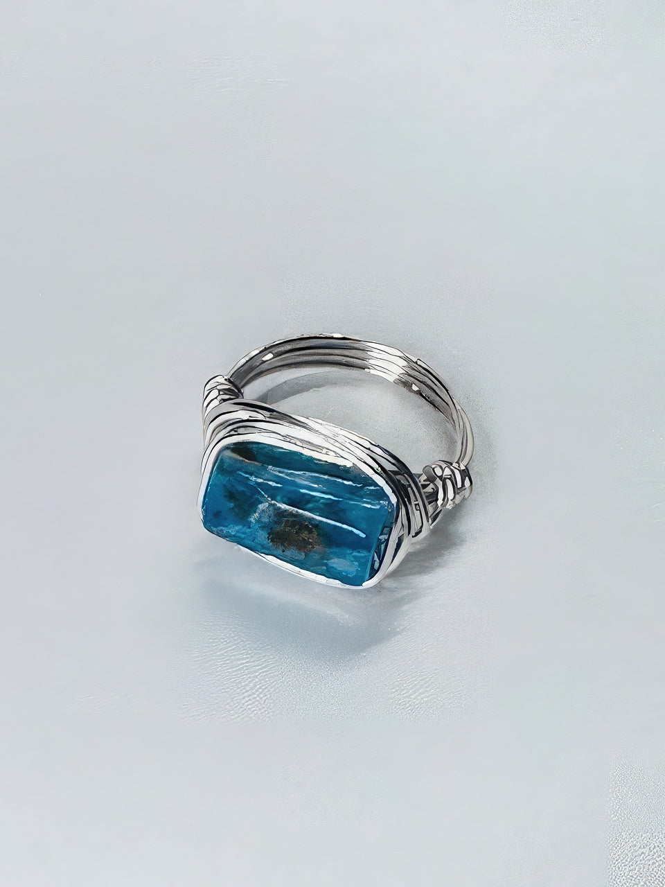 Rectangular shattuckite stone cozily wrapped in silver wire for a one-of-a-kind statement piece