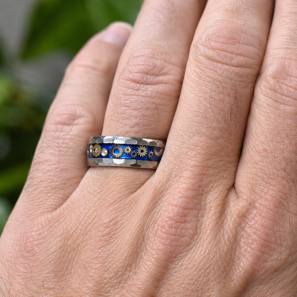 Timekeeper handmade watch gear ring worn on a hand, featuring genuine miniature watch parts in a faceted tungsten comfort-fit band.